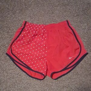 Nike Women's Red Athletic Running Shorts with Black Trim and Star Print